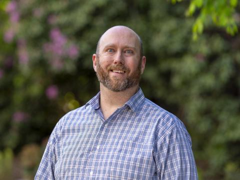 Headshot of Adam Miller.
