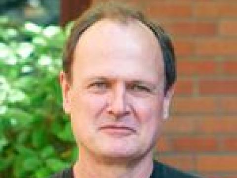Headshot of Bruce Bowerman.